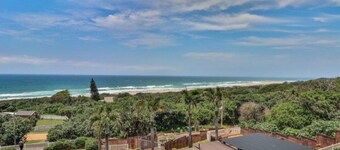 Wake up to the tranquil sight and sound of waves crashing against the shore.