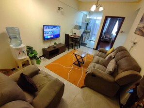 Comfort Apartment | Living area | 24-inch Smart TV with digital channels - Lux Suites Marcus Apartments Kilimani (Nairobi)