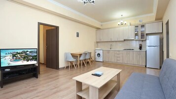 Standaard appartement | Woonruimte | Een televisie