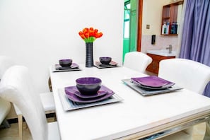 Business Apartment | Living area | 24-inch Smart TV with satellite channels - Lux Suites Marcus Garden Apartments (Nairobi)
