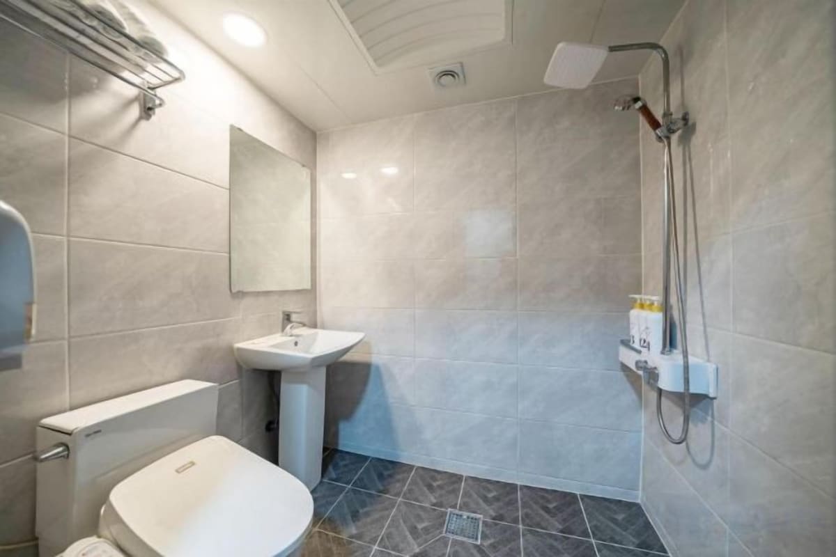 Deep soaking tub, designer toiletries, hair dryer, bathrobes