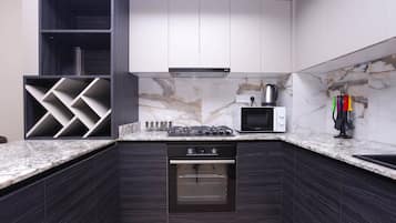 Family Apartment | Private kitchen | Fridge, microwave, oven, stovetop