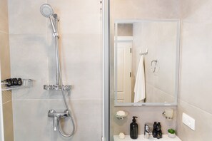 Shower, free toiletries, hair dryer, slippers