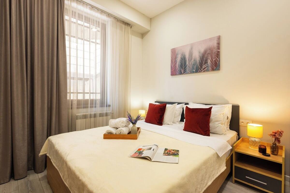 Economy Apartment | Premium bedding, desk, laptop workspace, blackout curtains