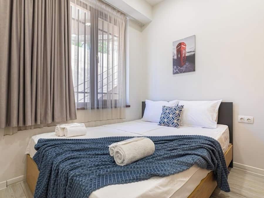 Classic Apartment | Premium bedding, desk, laptop workspace, blackout curtains
