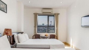 Family Twin Room, City View | In-room safe, desk, laptop workspace, soundproofing - Ruby Koi Danang (Da Nang)
