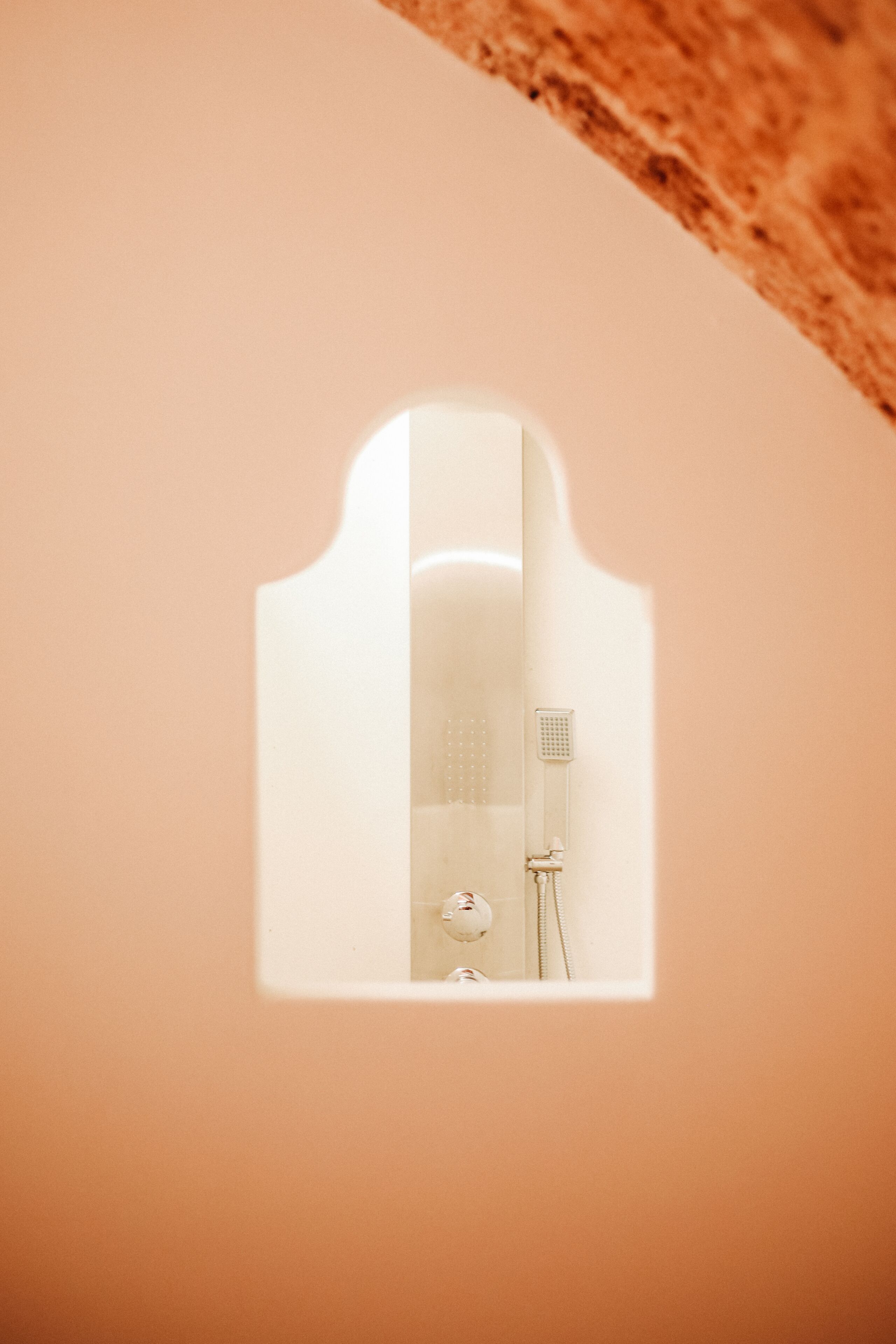 A bathroom with a shower, a toilet, and a sink.