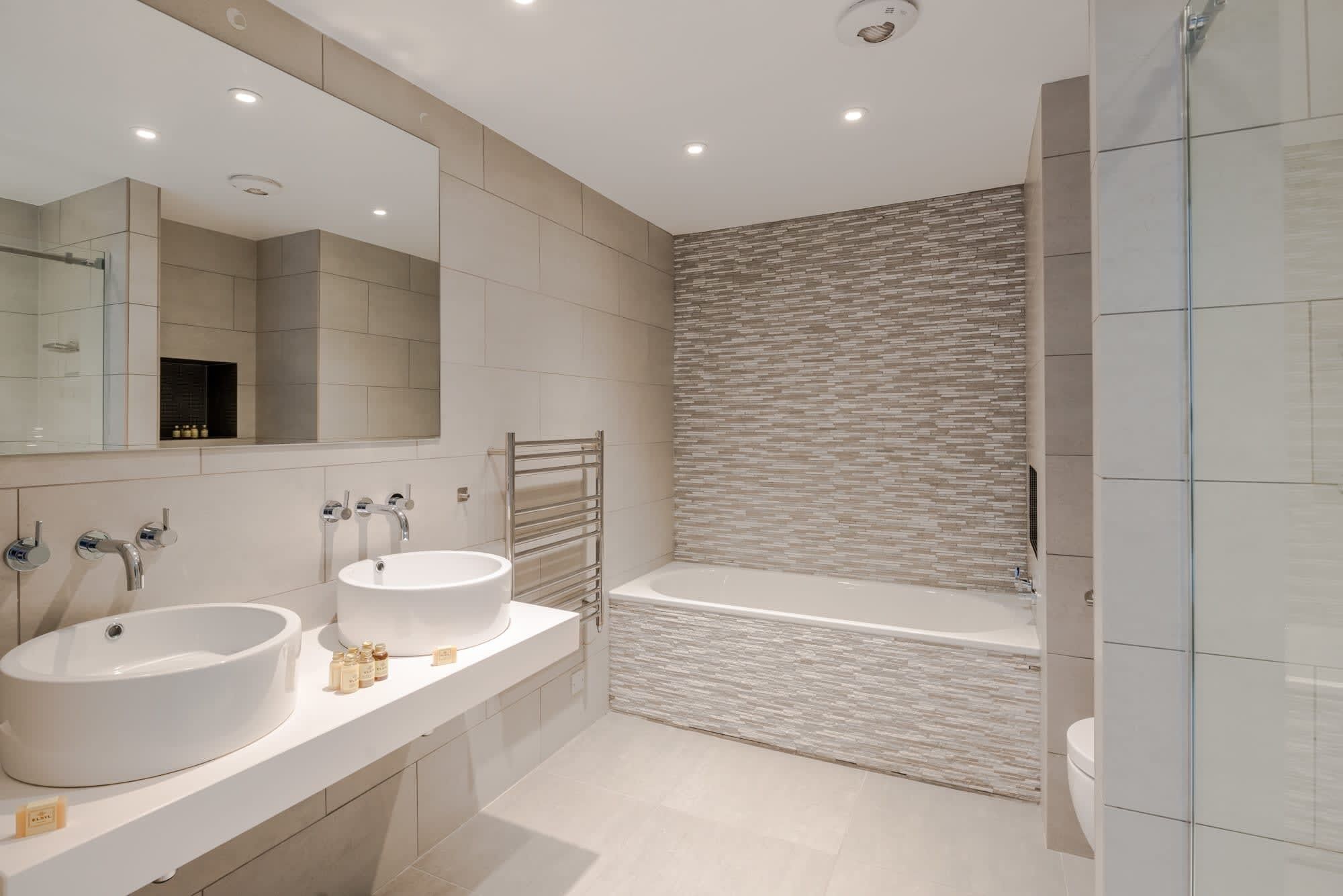 Shower, hair dryer, towels, shampoo