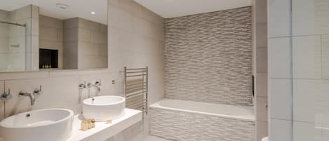 Shower, hair dryer, towels, shampoo
