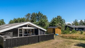 A building with a covered patio and a fenced area. - "Thrineke" - 600m from the sea by Interhome (Saltum)