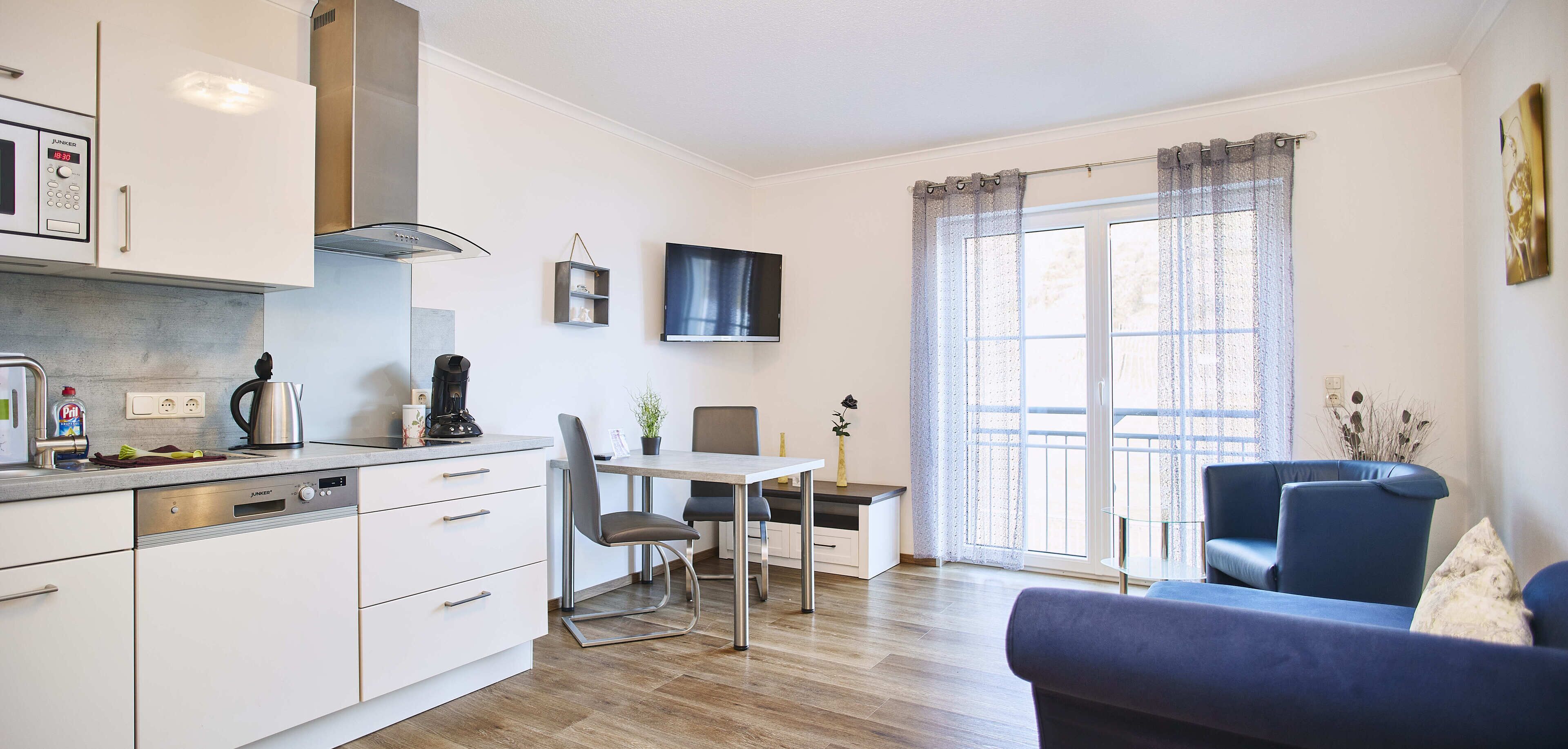 Deluxe-Apartment | Wohnbereich | Flachbildfernseher