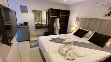 Premium bedding, minibar, blackout curtains, iron/ironing board