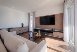 Deluxe Apartment | Living area | 32-inch LCD TV with cable channels - Horizon Two Bedroom Penthouse Hot tub (Becici)