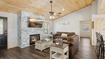 Smart TV, chimenea, reproductor de DVD y futbolito