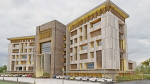 A modern hotel with a symmetrical facade, multiple balconies, and a parking lot with several cars. - Jacaranda Heights (Islamabad)