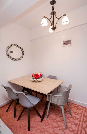 City Apartment | Living area | 24-inch Smart TV with digital channels - Lux Suites Sandalwood Gardens Apartments (Nairobi)