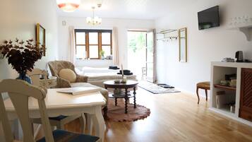 Romantic Studio, Kitchen, Lake View | Living area | 27-inch TV with cable channels