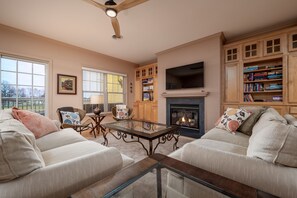 TV, fireplace, books - Three bedroom condominium in the Windswept community at The Peninsula! (Millsboro)