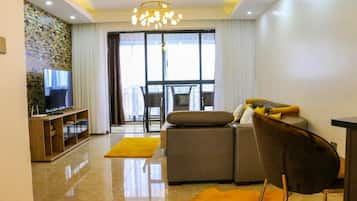 Apartamento conforto | Área de estar | Smart TV 24 polegadas com canais digitais