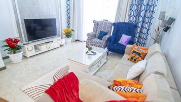 Business Apartment | Living area | 24-inch Smart TV with digital channels