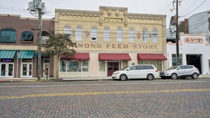 A building with a sign reading "Diamond Feed Store" and a red awning.