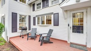A house with a porch, a grill, and two Adirondack chairs. - Charming Bangor Home w/ Deck < 1 Mi to Downtown (Bangor)