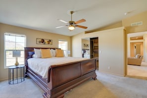 A bedroom with a large bed, a ceiling fan, and a window with blinds. - 11 Mi to Saguaro Nat'l Park! Family Home w/ Deck (Tucson)