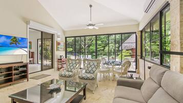 Villa | Living area | 50-inch flat-screen TV with cable channels