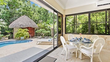 Villa | Living area | 50-inch flat-screen TV with cable channels