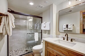 Premier Townhome | Bathroom | Hair dryer, towels, soap, shampoo