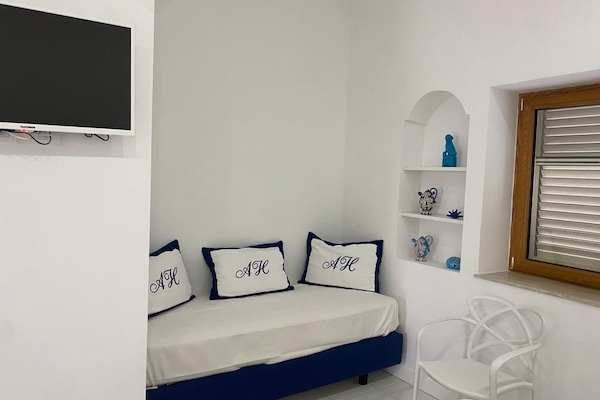 Family Room | Minibar (free items), desk, laptop workspace, blackout drapes