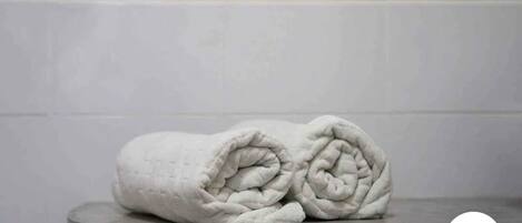 Hair dryer, towels, soap, shampoo