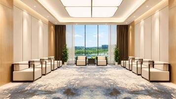A conference room with a large view, modern chairs, and a patterned carpet.