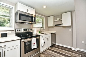 Fridge, microwave, stovetop, coffee/tea maker