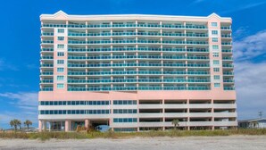 A multi-story hotel with a flat roof and numerous balconies. - Laguna Keyes 709 - Oceanfront 3BD/3BA (North Myrtle Beach)
