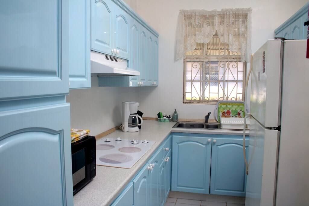 Fridge, microwave, stovetop, coffee/tea maker