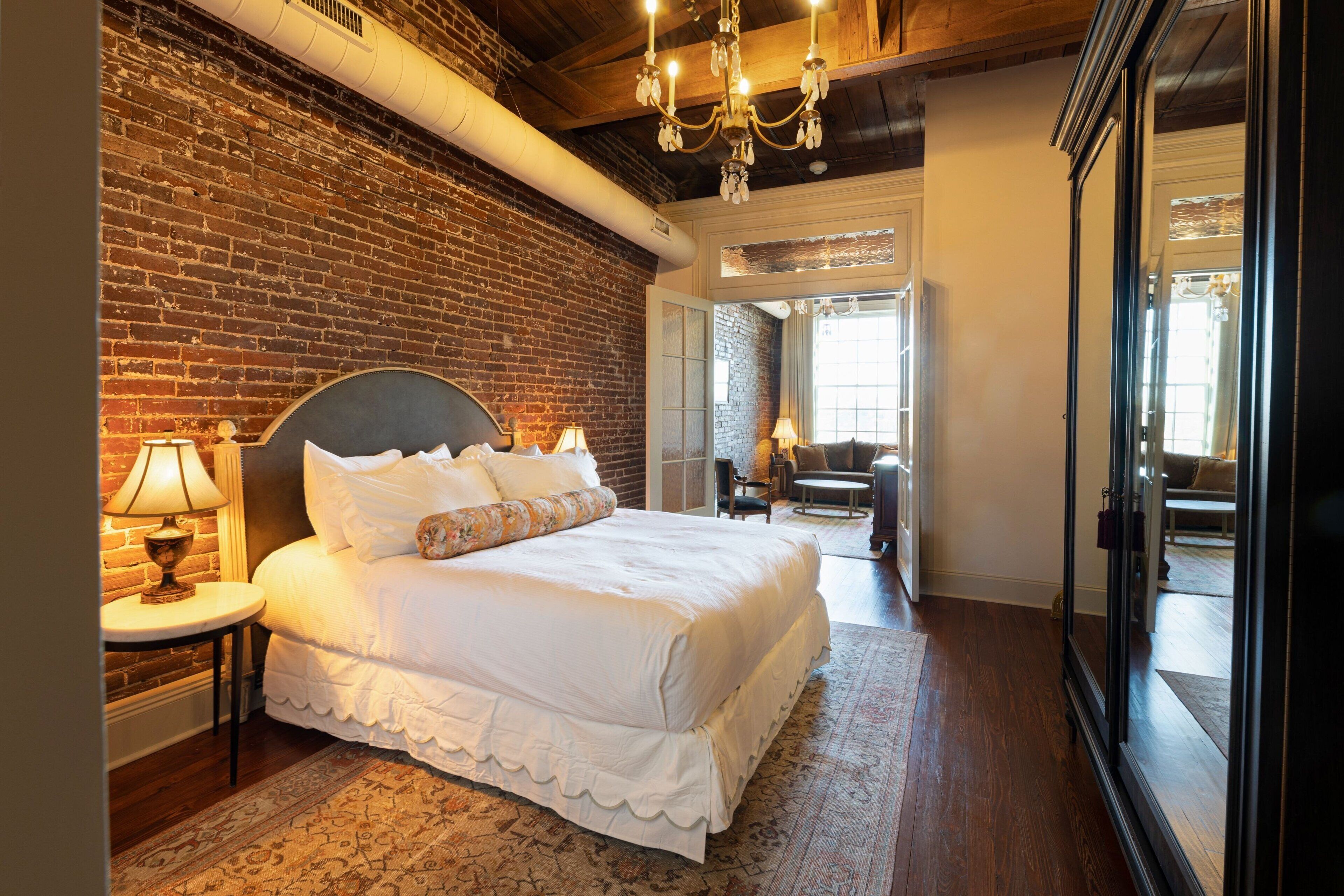 Premium bedding, desk, laptop workspace, blackout drapes