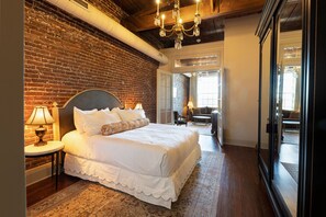 Premium bedding, desk, laptop workspace, blackout drapes
