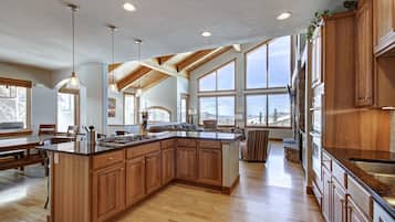 Premier Townhome | Private kitchen | Coffee/tea maker, electric kettle, dining tables