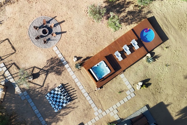 Experience desert luxury with a hot tub, cowboy pool, fire pit, and more!