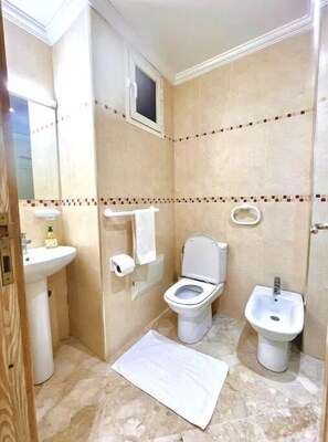 Hair dryer, towels, soap, shampoo