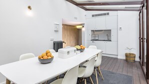 A modern kitchen with white cabinets, a built-in sink, and a small countertop. - Home Suite Home II - Studio apartment with large shared terrace (Madrid)