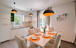 Enjoy meals in this well-appointed dining area with a large table and comfortable seating.