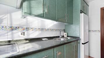 Fridge, microwave, stovetop, coffee/tea maker
