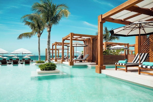 5 outdoor pools, cabanas (surcharge), pool umbrellas