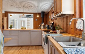 Fridge, stovetop, dishwasher, coffee/tea maker