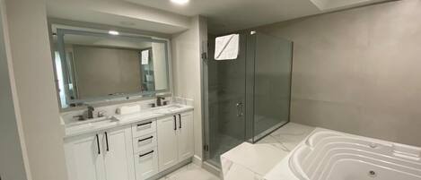Jetted tub, hair dryer, towels, soap