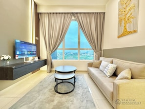 Comfort Apartment, 2 Bedrooms, City View | Living area | 42-inch Smart TV with cable channels, Netflix, streaming services - Amber Cove Melaka Sea View by Stayrene (Malacca City)