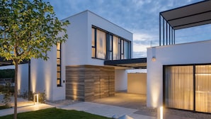 A modern two-story building with large windows and a flat roof. - Villa Noble 1 with Spa (Bale)