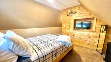 1 bedroom, desk, iron/ironing board, travel crib